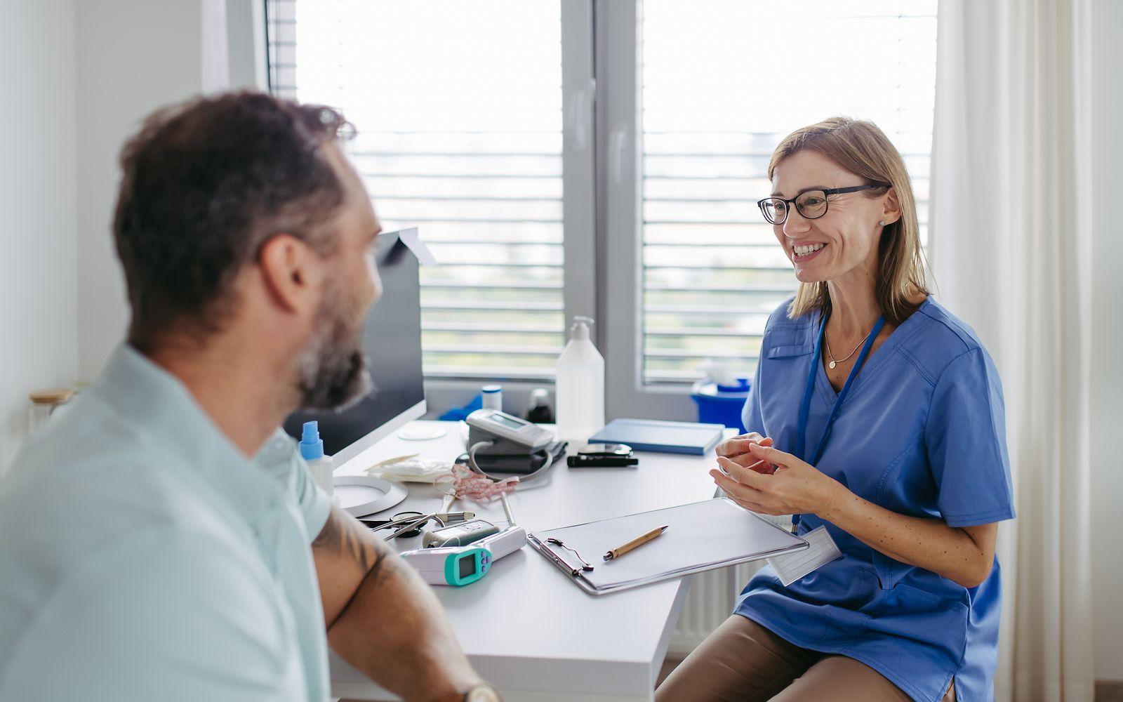 Image: Patient and doctor in conversation.