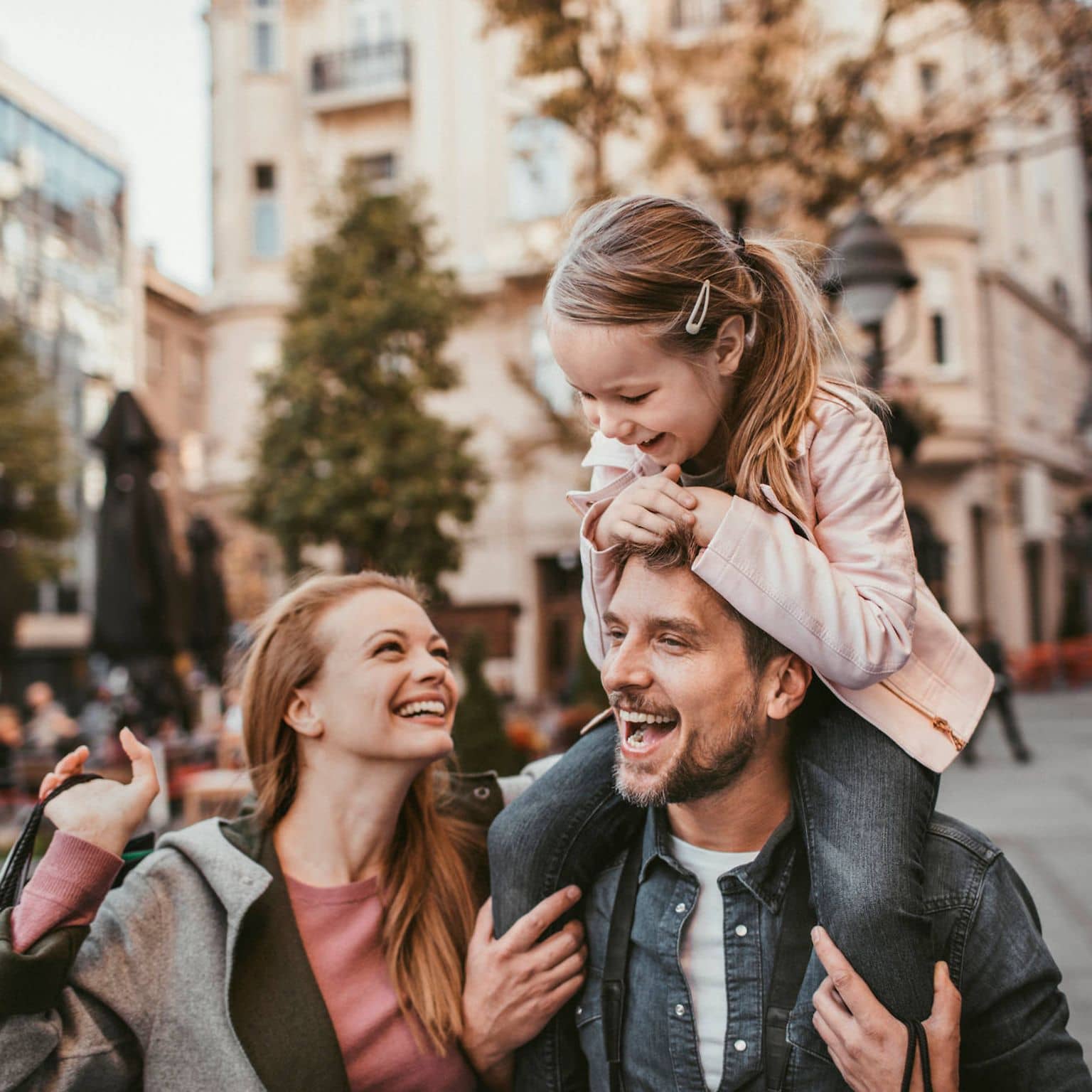 A family having a carefree time and walking through the city.