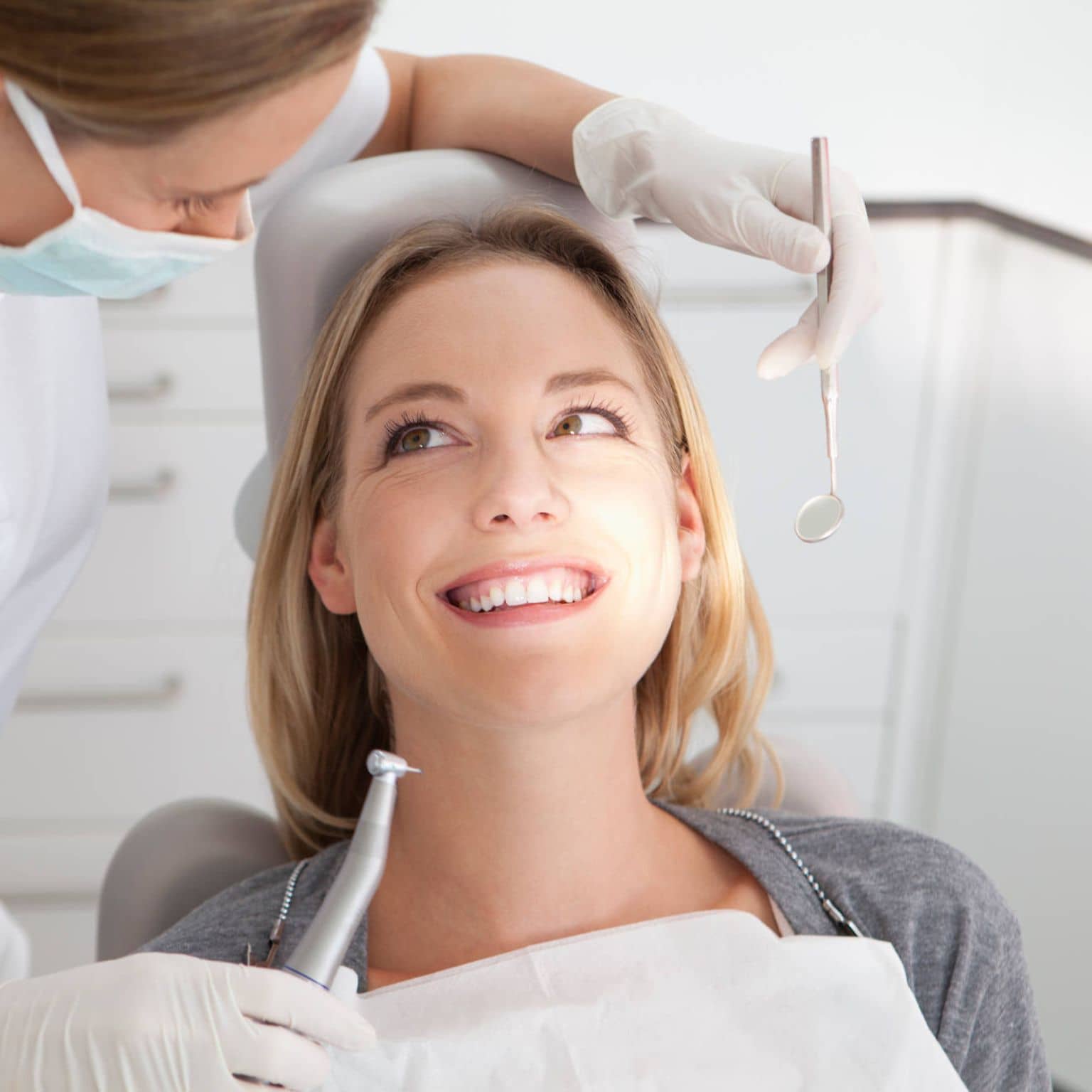 Woman being treated at the dentist